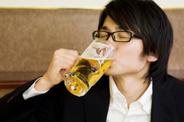 Young man drinking beer