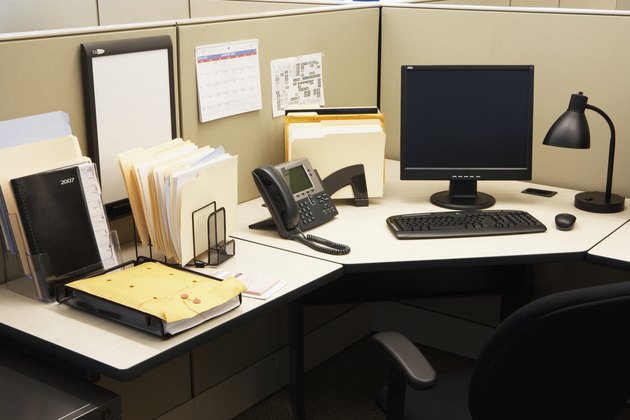 Computer and landline phone in office, elevated view
