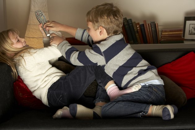 Brother And Sister Fighting Over Remote Control