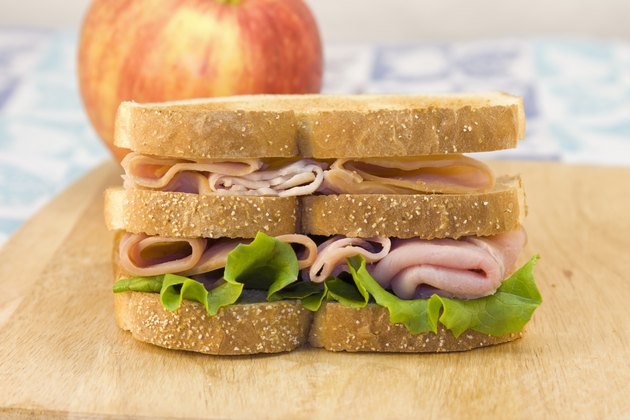 triple decker sandwich on cutting board