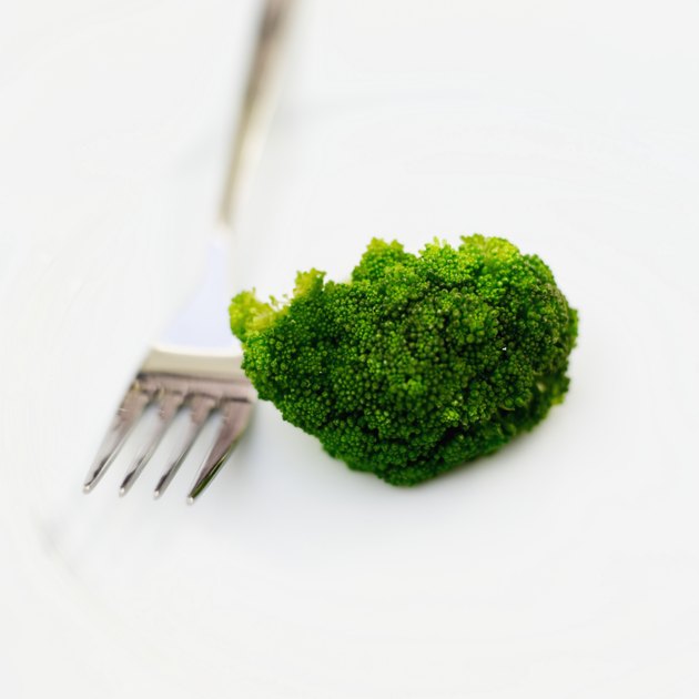 Close-up of a piece of broccoli and a fork