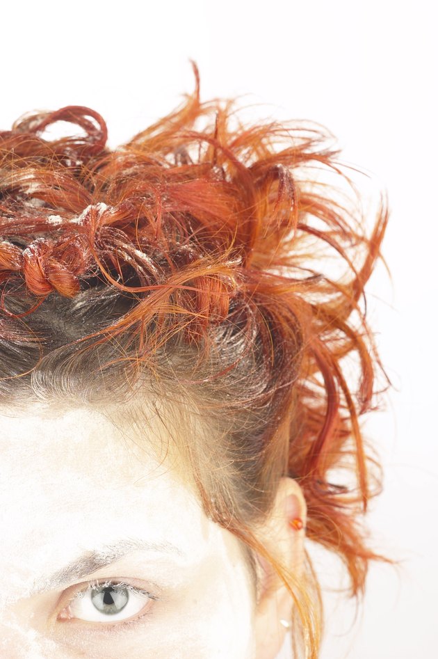 Cropped head shot of girl with curly red hair