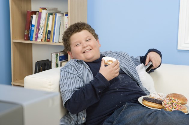 Boy Eating Donuts