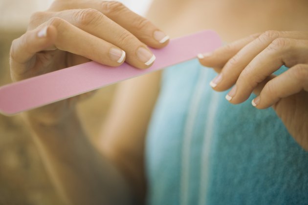 Woman filing nails