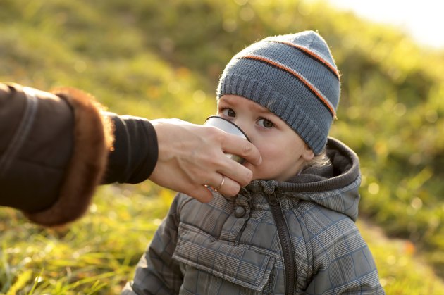 Toddler drinks tea