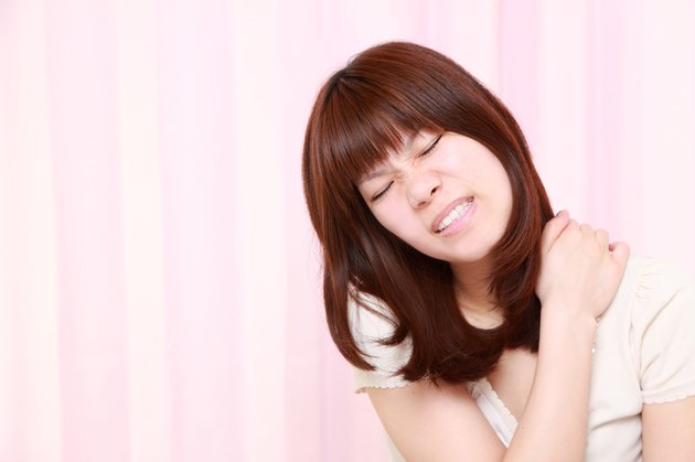 woman suffers from neck ache