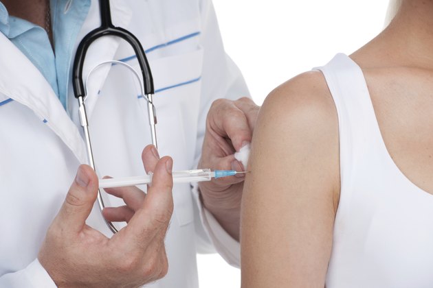 Person receiving a vaccine.