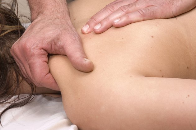 Woman having deep tissue massage