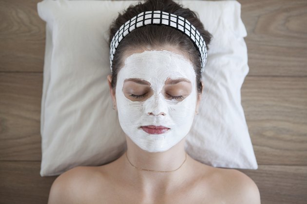 Young woman with facial mask