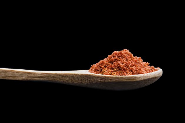 Isolated spices on a wooden spoon