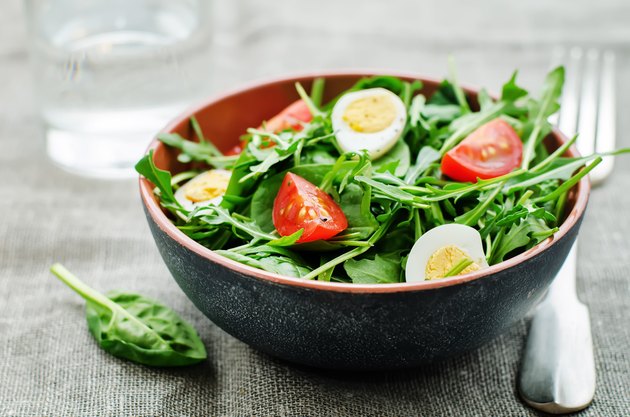 salad with arugula, spinach, tomatoes and eggs.