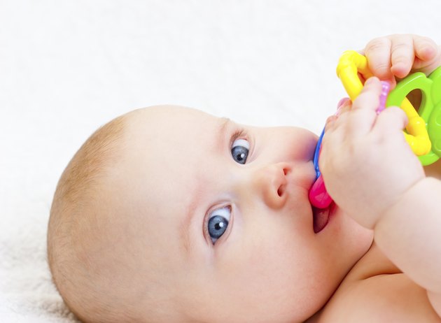 Infant with teething toy