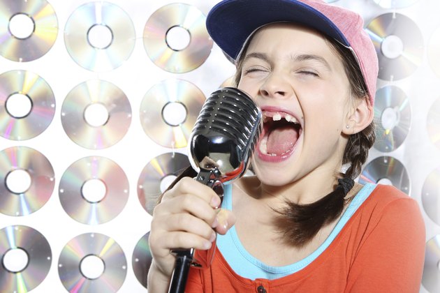 Singing girl in the orange cap