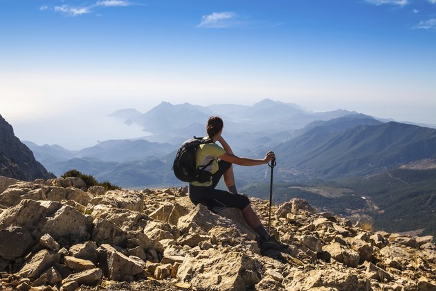 tourist woman on the top of mount,