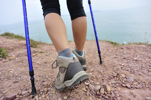 hiking legs on seaside mountain trail