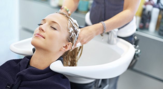 Letting experienced hands treat her tresses