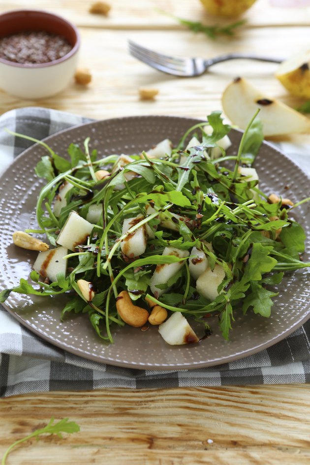 fresh salad with pear, arugula and nuts
