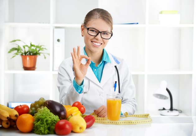 Doctor dietitian showing "ok"