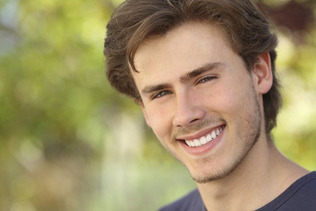 Handsome man face with a white perfect smile