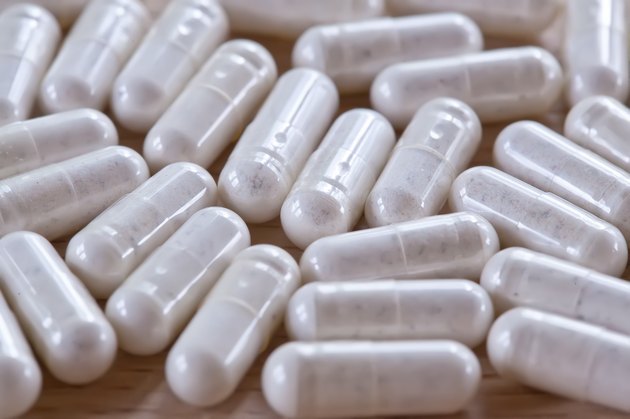 Capsules on a wooden surface