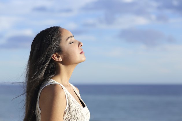 Profile of an arab woman breathing fresh air