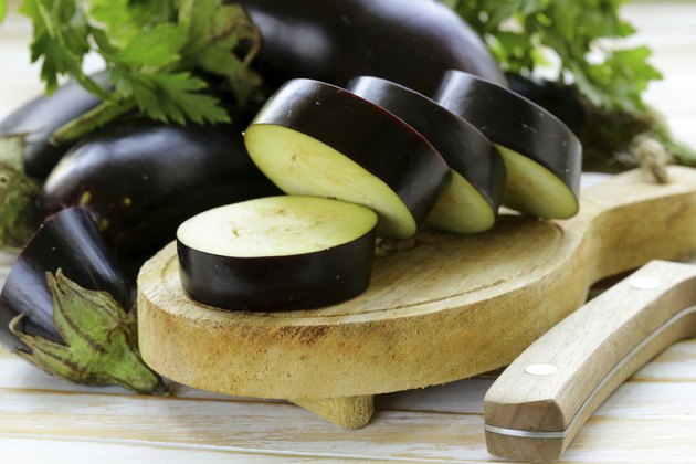 fresh ripe vegetables purple eggplant on a wooden table