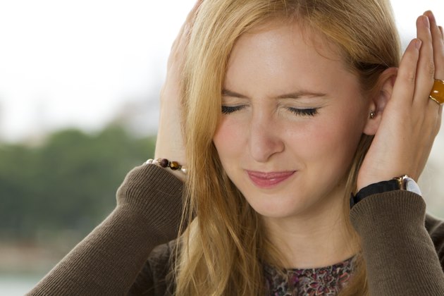 Blond Girl Covering Her Ears