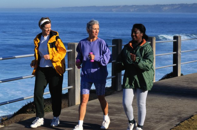 Three Women Walking Beside the Ocean