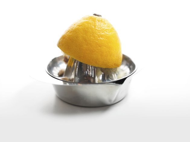 halved lemon on a squeezer