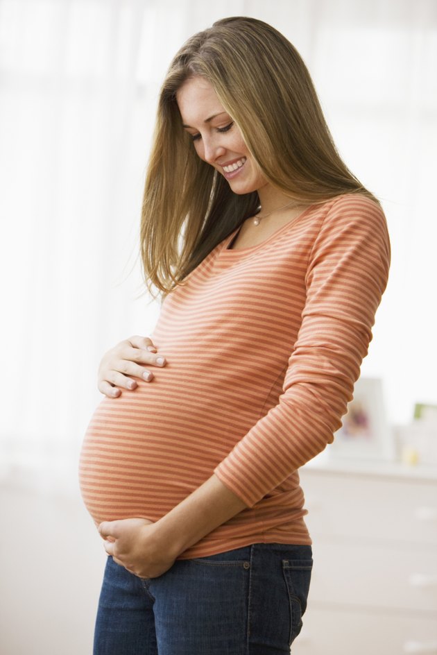 Beautiful young pregnant woman smiling
