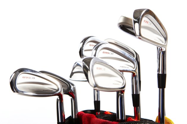 Golf clubs against white background
