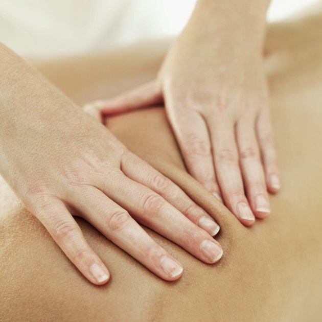 close-up of a person getting a back massage