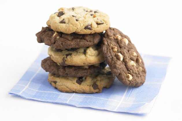 Cookies piled up on a checkered napkin, studio shot