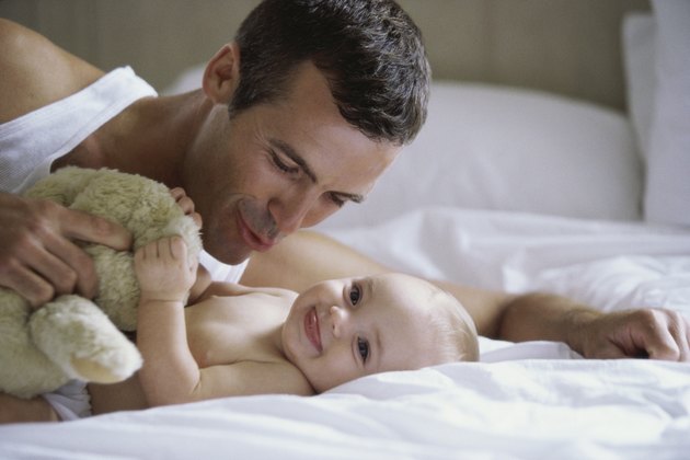 Close-up of a father playing with his baby boy
