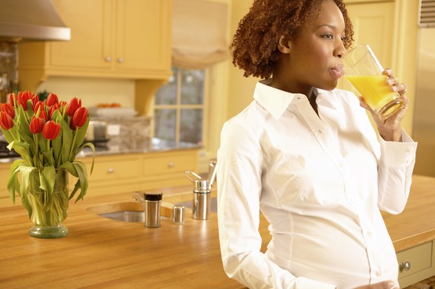 Pregnant woman with orange juice
