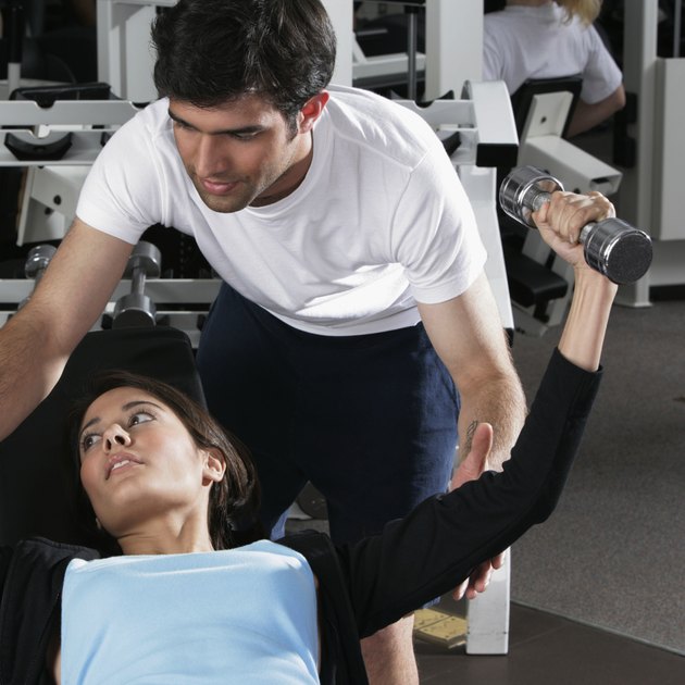 High angle view of a young woman exercising in a gym