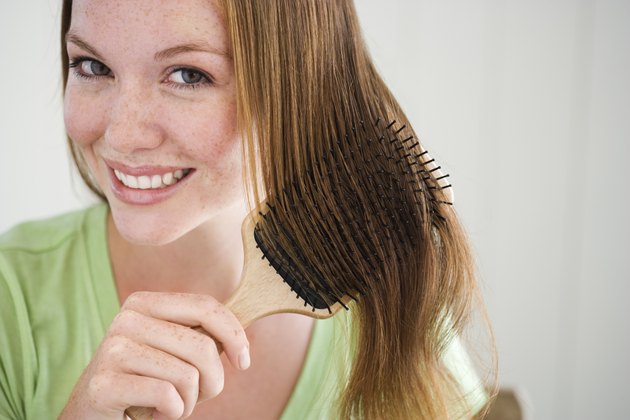 Woman combing her hair