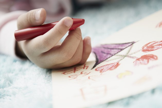 Girl Coloring with Crayon