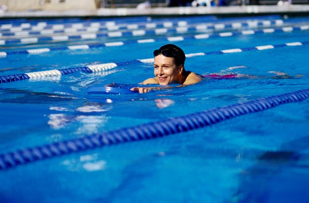 Swimmer Using Buoyancy Aid in Pool