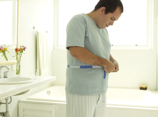 Man measuring his waist