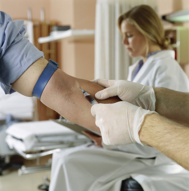 Male doctor taking a blood sample