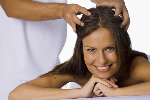 Woman having a scalp massage