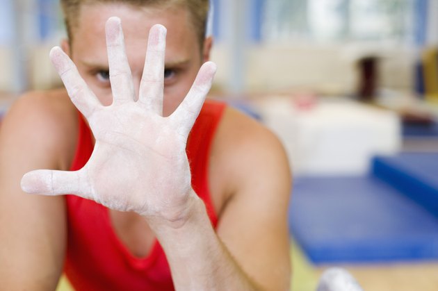 Male gymnast's chalky hand