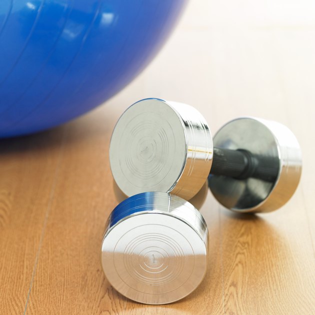 sport goods and dumbbells and a ball
