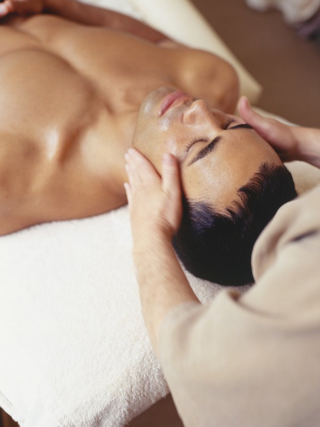 Young man lying in beauty parlour, elevated view