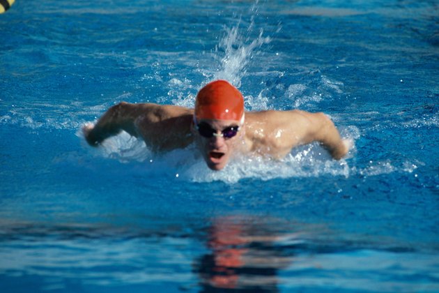 Young man swimming the butterfly stroke