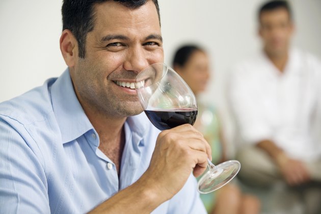 Portrait of a mature man drinking red wine