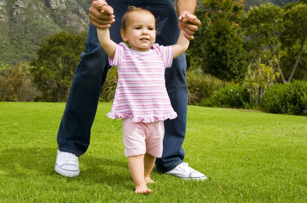 Baby being held up