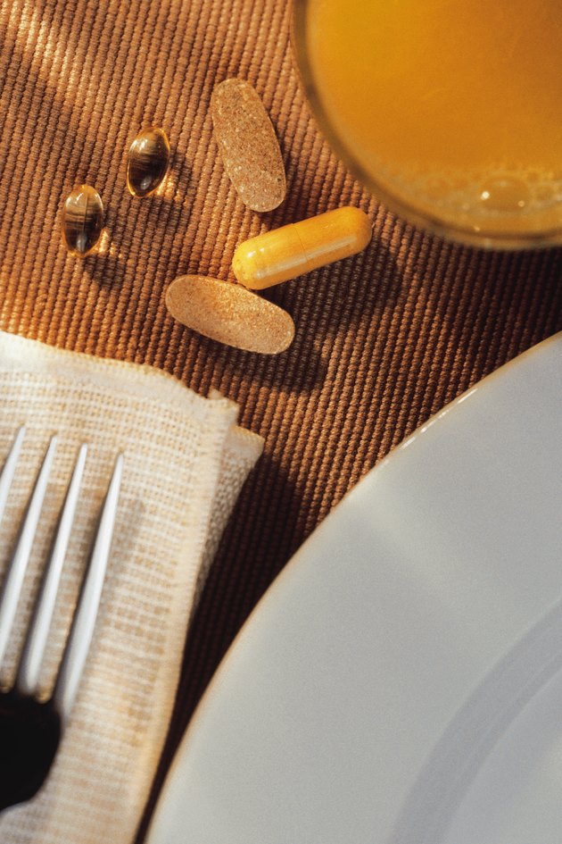 Breakfast setting with vitamins and orange juice