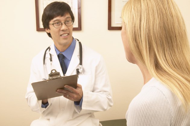 Male doctor talking to a female patient
